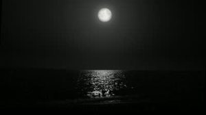 stock-footage-night-moon-and-moonbeam-in-sea