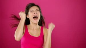 stock-footage-excited-winner-woman-celebrating-winning-something-very-happy-ecstatic-woman-jumping-and-screaming